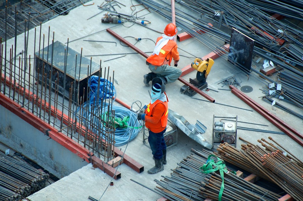 Construction crew working with rebar and steel on an active site