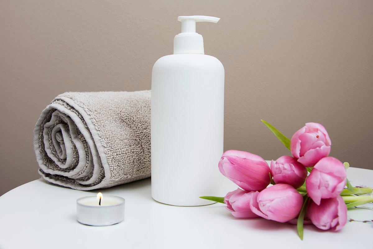 Spa still life with towel, candle and flowers for a wellness website