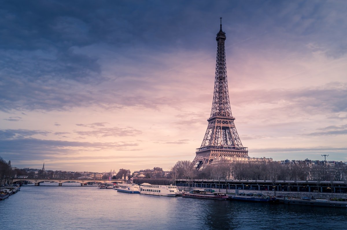 Eiffel Tower at dusk representing dream destinations a travel agency sells