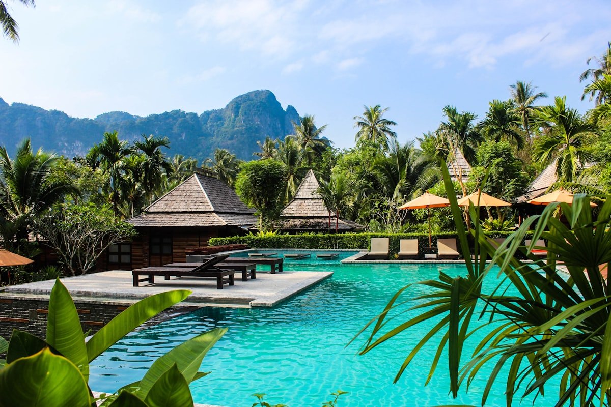 Tropical resort pool with mountains for a hotel and resort template
